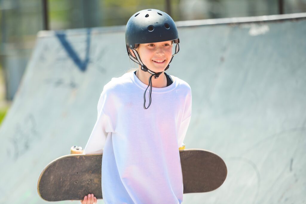 A,Child,Girl,Playing,Skate,Or,Skateboard,At,Parking,To