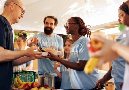 Generous,Volunteers,At,Food,Bank,,Distribute,Essential,Items,And,Nourishments